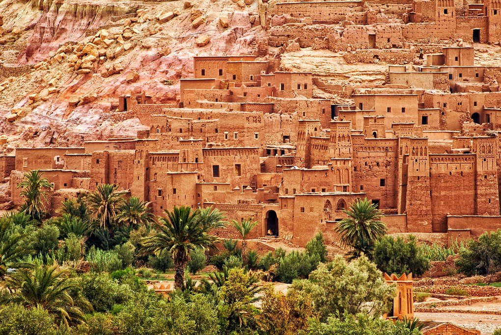 Ait Benhaddou is a clay fortified city ksar along the caravan route between Sahara and Marrakech Morocco. It's a popular film location and UNESCO World Culture Heritage Site.
